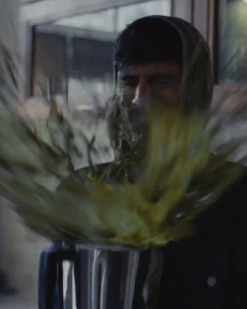 J D Ayush Kumar in the Swiggy Instamart commercial - a mixer jar spraying greens across the frame
